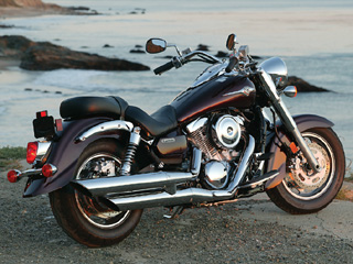 The Kawasaki includes features such as a helmet lock, adjustable shock damping and a tool kit under the locking side cover. That ugly black license-plate support needs a chrome replacement